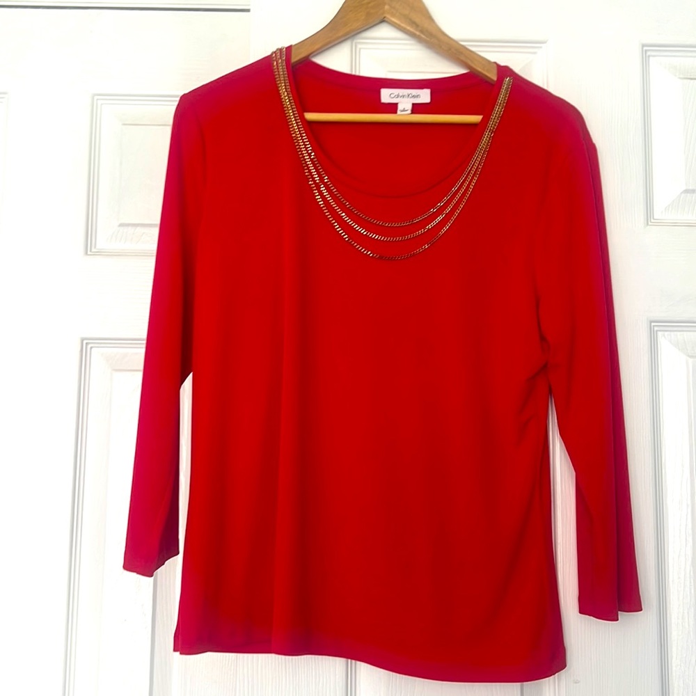 Calvin Klein red blouse with gold faux chain